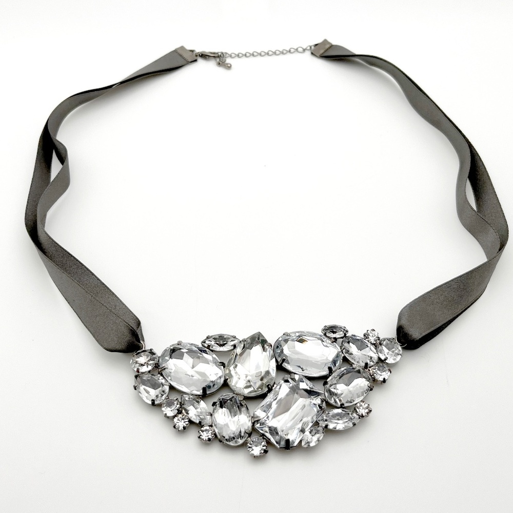 Statement Crystal Necklace that hangs on a Gunmetal colored Ribbon